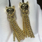 C earrings, 18K gold, inlaid with 34 round bright cut diamonds, Shafrey garnet leopard eyes, Onyx factory in China supplier